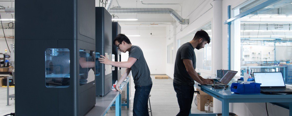 Two men working with Markforged 3D Printers