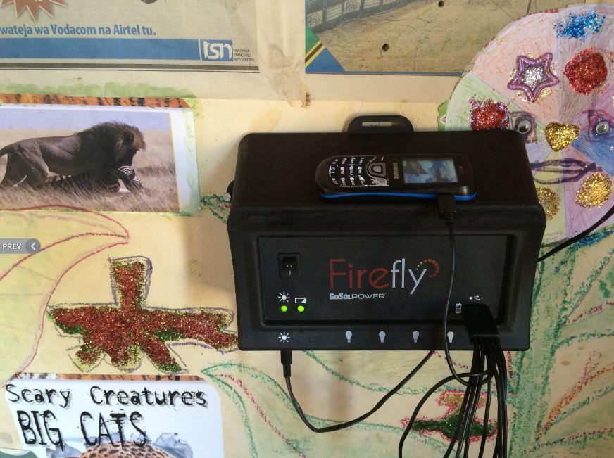 The controller for a Firefly solar-powered lighting system installed on a wall in Tanzania.