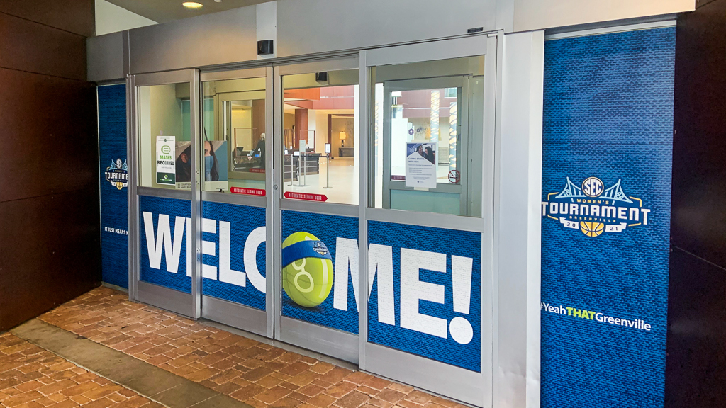Womens NCAA College Basketball vinyl window graphics applied to an automatic door.