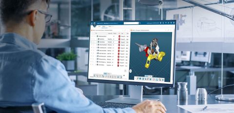 A man using the 3DEXPERIENCE Works SOLIDWORKS cloud platform on a computer