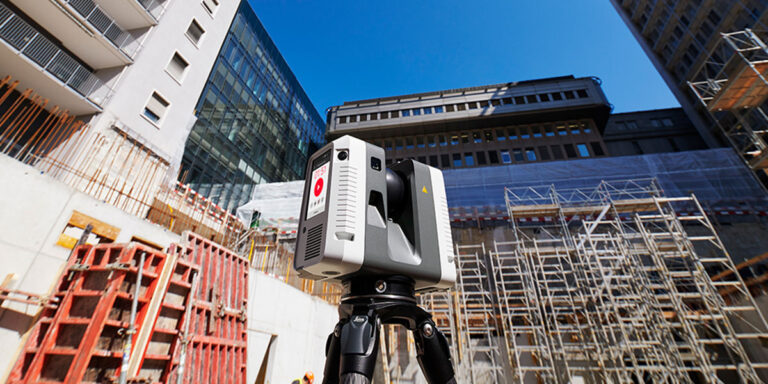 Leica RTC 360 laser scanner on a construction site.